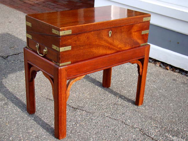 A Wonderful brass bound 'Campaign' style mahogany lap desk circa 1830 on a custom made stand